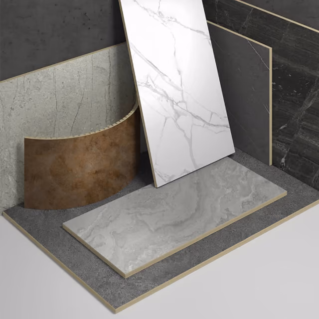 Carbon Rock Board panels in marble and stone finishes stacked and leaning