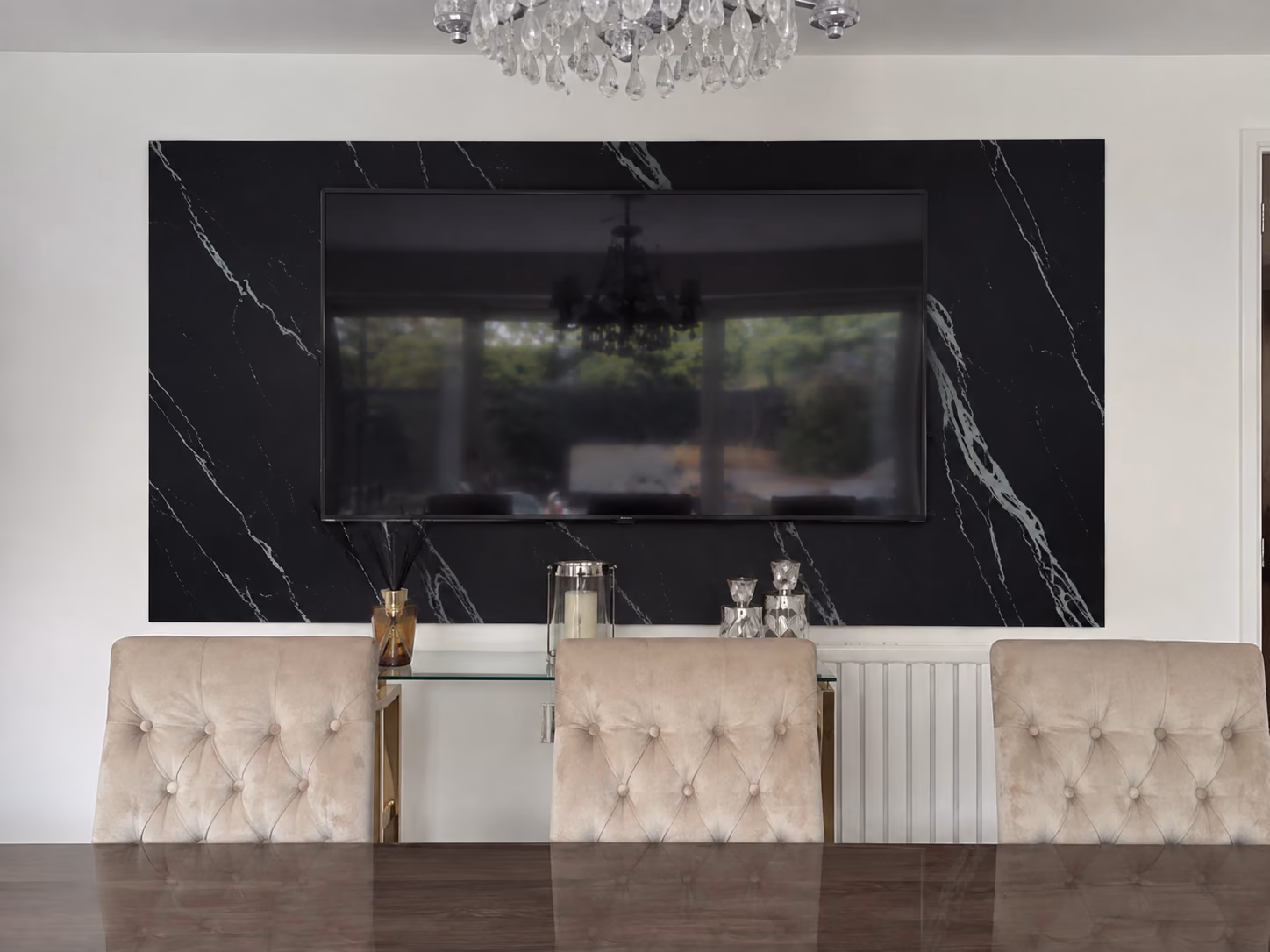 Black marble feature wall in a dining room